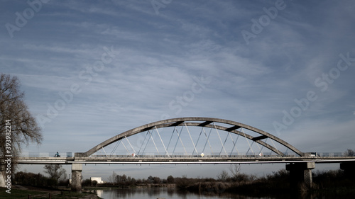 Picture of bridge in Poland with blue sky.