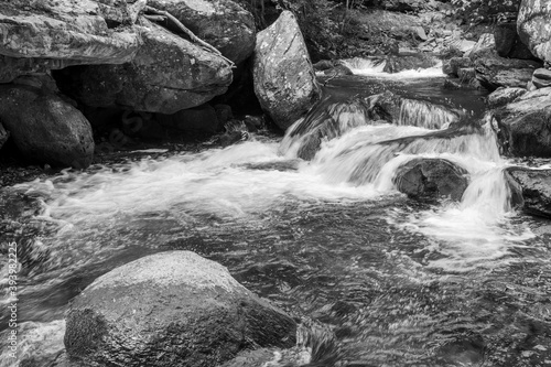 Long exposure of a waterfall on the East Lyn river flowing through the woods at Watersmeet in Exmoor National Park photo