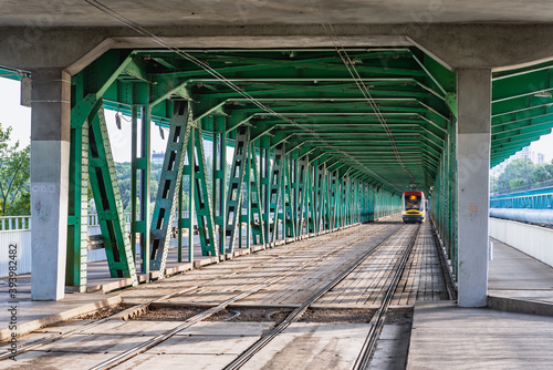 Tramway tracks on a Gdanski Bridge over River Wisla in Warsaw, capital city of Poland photo