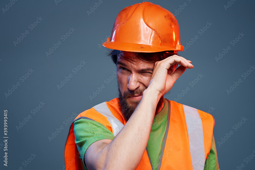 Bearded man in work uniform construction professional cropped view Bearded man in work uniform construction professional cropped view