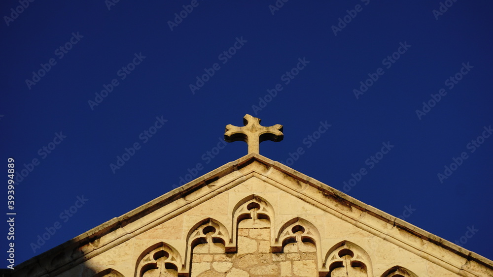 church roof with a sotne cross