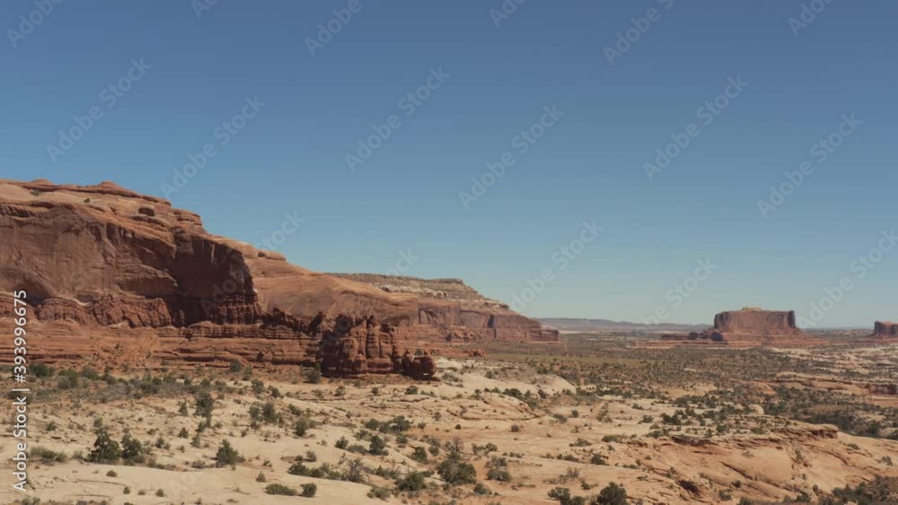 aerial of desert with large rock formation aerial of desert with large rock formation
