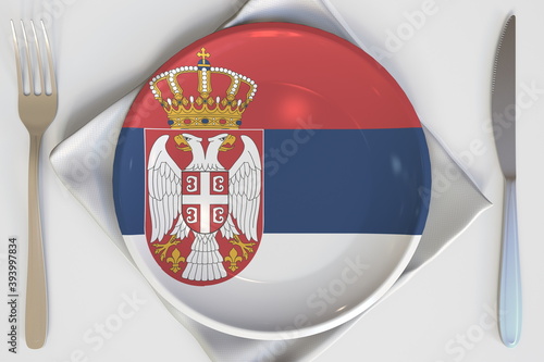 Plate with flag of Serbia on the table, national cuisine conceptual 3d rendering photo