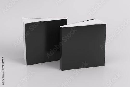 Φωτογραφία Two softcover or paperback square black mockup books standing on the white background
