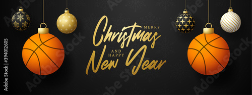 Merry Christmas and Happy New Year luxury Sports greeting card. Basketball ball as a Christmas ball on black background. Vector illustration.