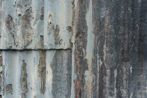old peeling corrugated metal fence