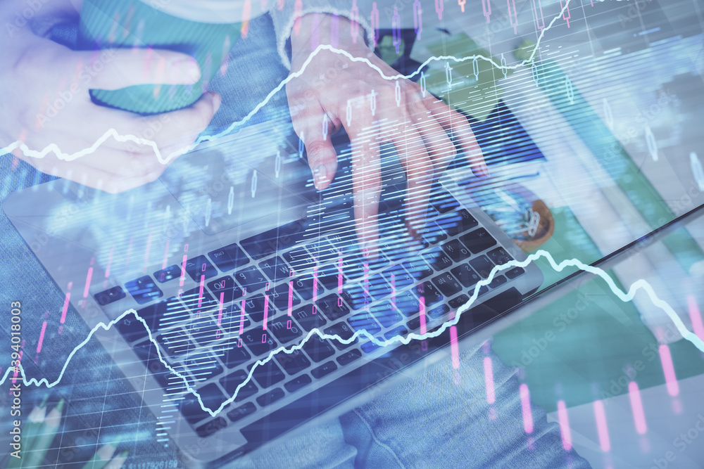 Double exposure of woman hands typing on computer and forex chart hologram drawing. Stock market invest concept. Double exposure of woman hands typing on computer and forex chart hologram drawing. Stock market invest concept.