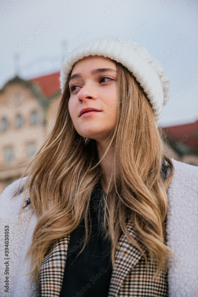 Portrait of a beautiful young woman with winter clothes