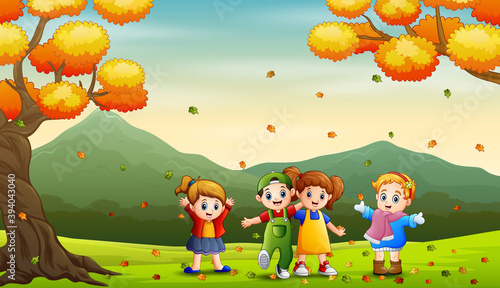Fototapeta Naklejka Na Ścianę i Meble -  Happy kids playing outdoors in autumn