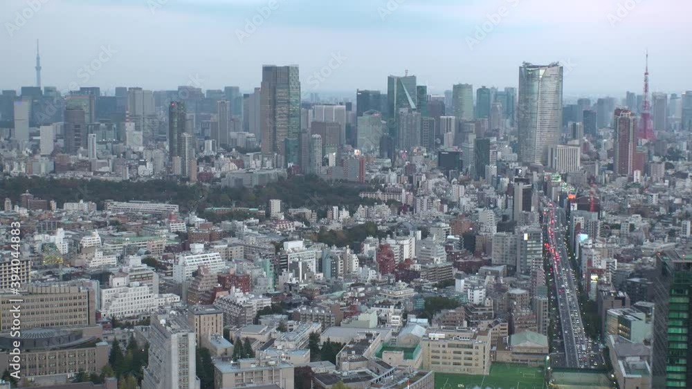 TOKYO, JAPAN : Wide aerial high angle sunset CITYSCAPE of TOKYO. View of buildings around Roppongi from Shibuya. Japanese city life and metropolis concept. Time lapse zoom out shot dusk to night. TOKYO, JAPAN : Wide aerial high angle sunset CITYSCAPE of TOKYO. View of buildings around Roppongi from Shibuya. Japanese city life and metropolis concept. Time lapse zoom out shot dusk to night.