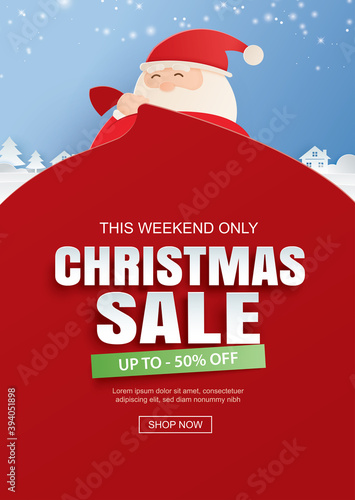 Santa claus and a huge bag of gifts with christmas sale promotion. Use for banner, poster, cover and all media. photo