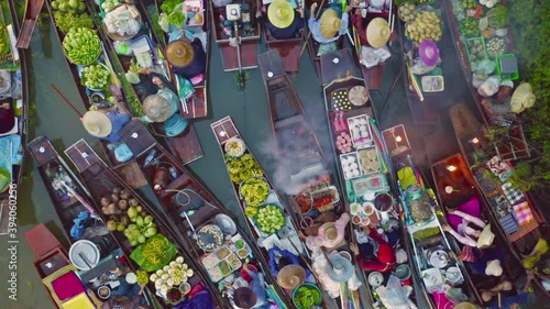Damnoen Saduak Floating Market or Amphawa. Local people sell fruits, traditional food on boats in canal, Ratchaburi District, Thailand. Famous Asian tourist attraction destination. Festival in Asia.