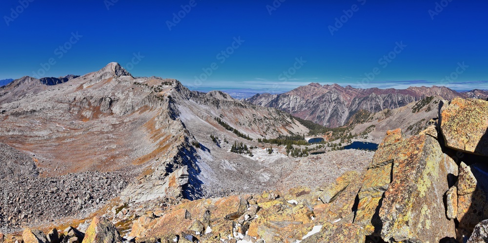 Red Pine Lake mountain landscape scenic view from White Baldy and Pfeifferhorn hiking trail, towards Little Cottonwood Canyon, Wasatch Rocky mountain Range, Utah, United States. 