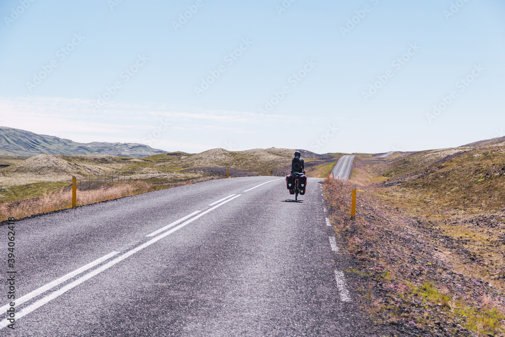 Cyclist in Iceland with saddlebags Cyclist in Iceland with saddlebags