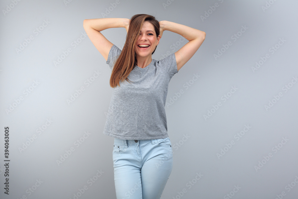 Happy emotional woman wearing gray t shirt with copy space. Happy emotional woman wearing gray t shirt with copy space.