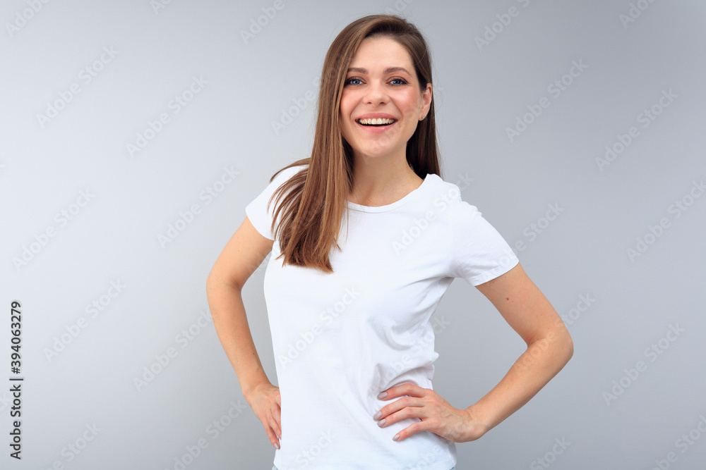 Smiling woman wearing white t-shirt with copy space. Smiling woman wearing white t-shirt with copy space.