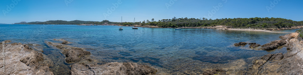 Discovery of the island of Porquerolles in summer. Deserted beaches and pine trees in this landscape of the French Riviera Discovery of the island of Porquerolles in summer. Deserted beaches and pine trees in this landscape of the French Riviera