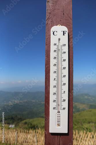 A THERMOMETER measures the air temperature.