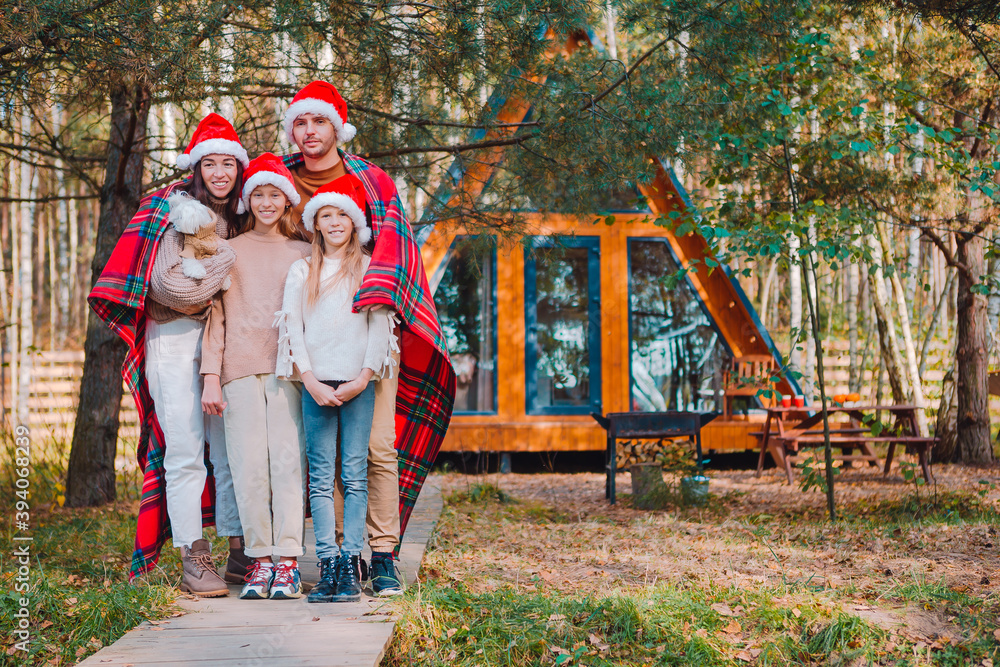 Obraz premium Beautiful family with kids walking at Christmas day