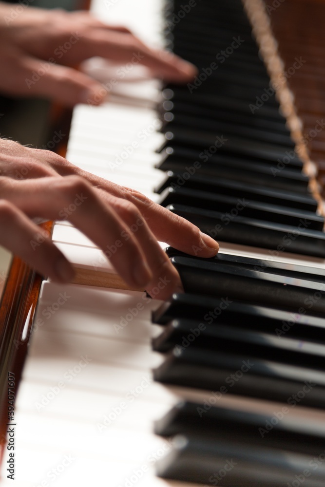 Hands on Piano Keyboard - Close Up
