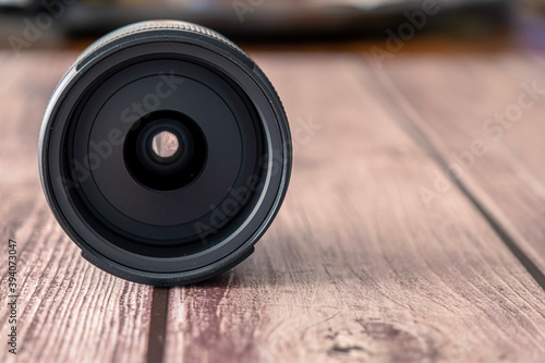 Modern Digital Camera Lens on Wood Table for photography