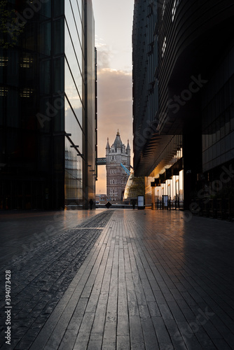 Tower Bridge on an early summer morning sunrise when the streets are empty and tranquil