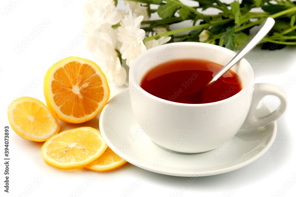 Hot drink with a lemon and flowers Hot drink with a lemon and flowers