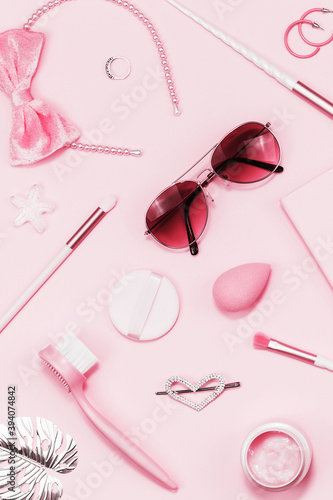 Tender pink monochrome feminine makeup tools and silver accessories. brushes eye lashes vanish on candy pink. Flat lay, birthday beauty cosmetics blogger advert pattern concept. Heart, love hair clips