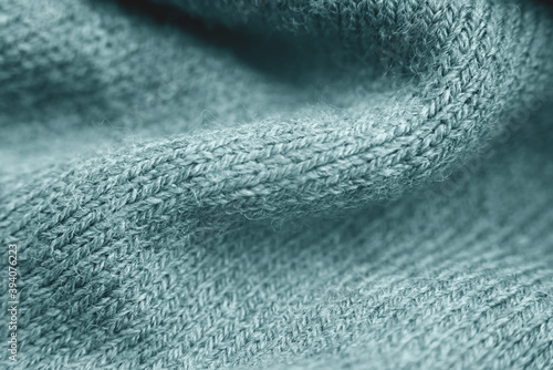 Fotografie Close up of green knitted textured background.