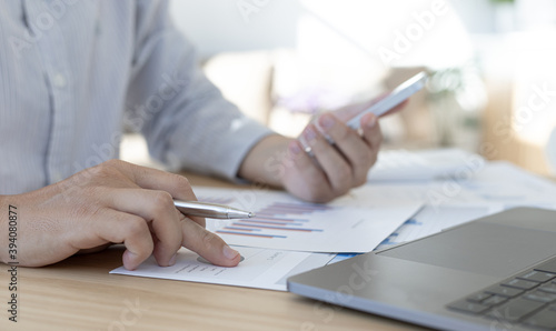 Photography Businessman with smart numbers in private office.
