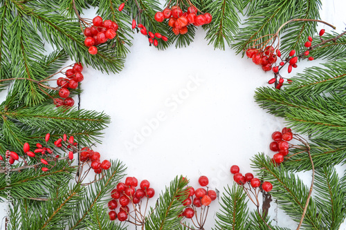 New Year and Christmas border design. White wooden background with fir tree. Top view with copy space.