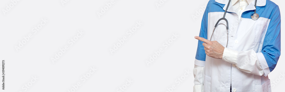 Man in a medical coat. Doctor concept. Banner. Copy space. Place for text. Man in a medical coat. Doctor concept. Banner. Copy space. Place for text.