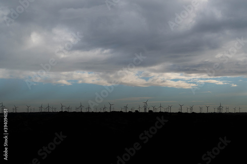 Wind energy windmills silhouetted on the horizon in Spain
