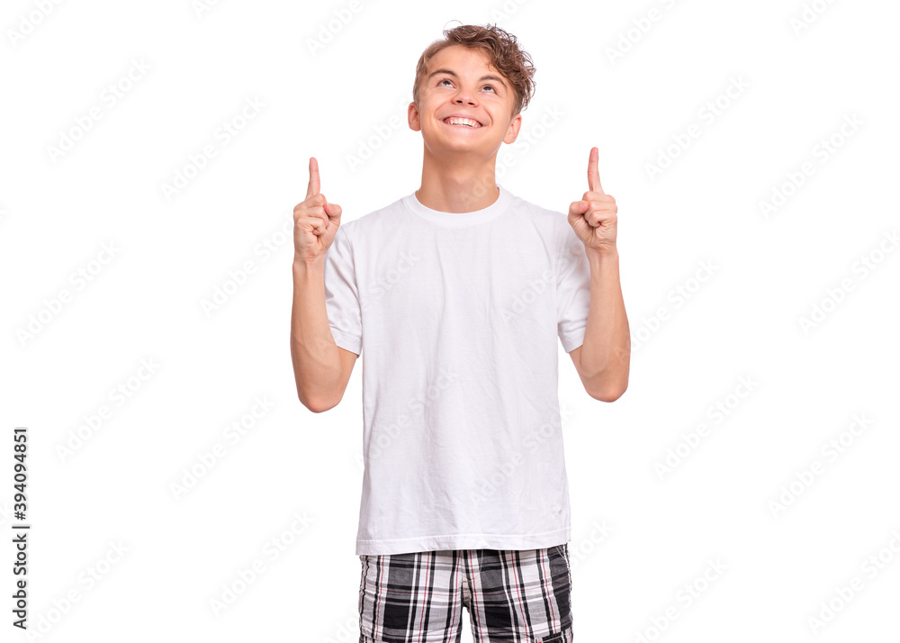 Cute teen boy pointing up, gesturing idea or doing number one gesture. Cute teen boy pointing up, gesturing idea or doing number one gesture.