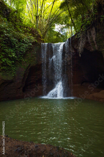 Beautiful waterfall in rainforest. Tropical landscape. Slow shutter speed, motion photography. Nature background. Environment concept. Suwat waterfall, Bali, Indonesia