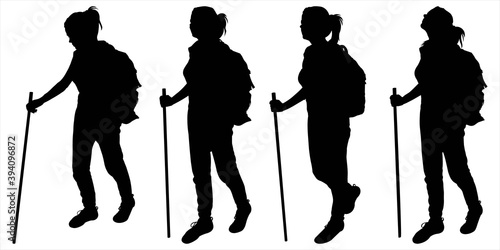 Tourist with a large backpack on her back. Group of girls follow each other. Woman with a walking stick in her hands. Hiking. Four black female silhouettes are isolated on a white background.