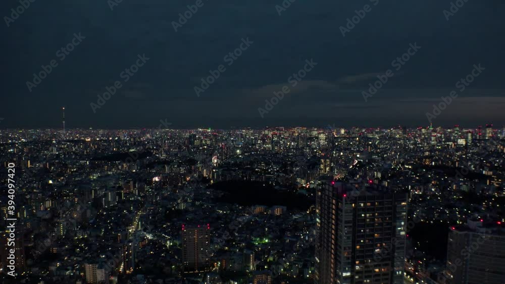TOKYO, JAPAN : Aerial high angle sunrise CITYSCAPE of TOKYO. View of buildings at downtown central area. Japanese city life and urban metropolis concept. Time lapse shot night to morning. TOKYO, JAPAN : Aerial high angle sunrise CITYSCAPE of TOKYO. View of buildings at downtown central area. Japanese city life and urban metropolis concept. Time lapse shot night to morning.