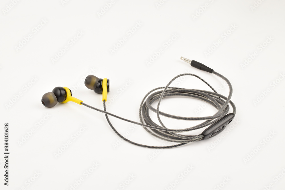 Folded earphone with mic isolated on white background
Folded earphone with mic isolated on white background