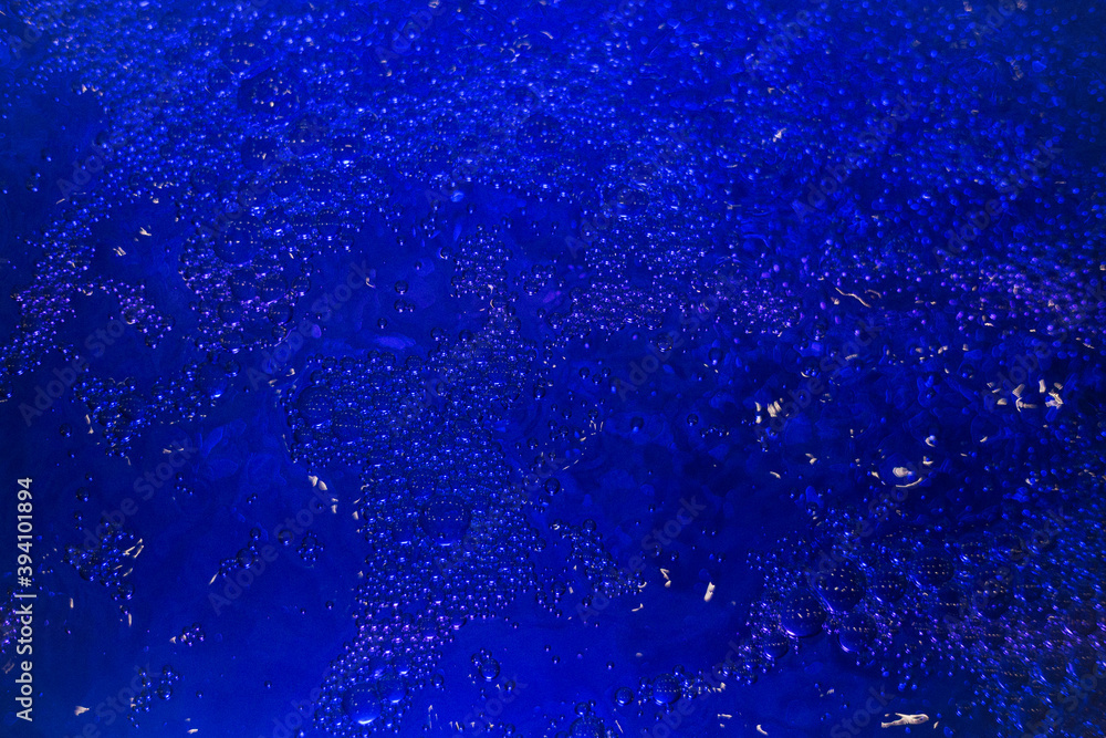 Obraz premium Abstract background blue water in the pool, lots of bubbles in the water