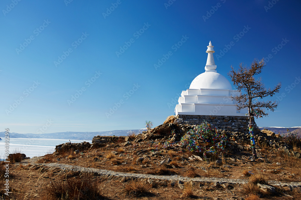 Buddhist Stupa at Ogoy island in winter. Lake Baikal, Russia
