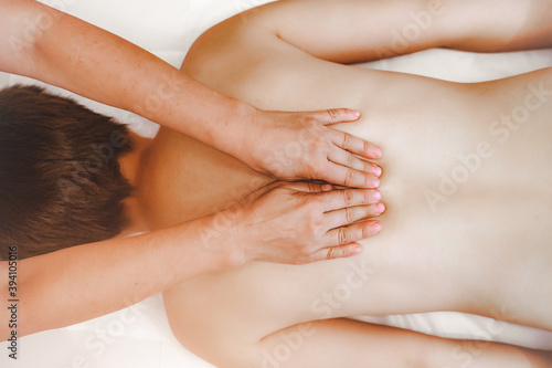 Wallpaper Mural Close-up view masseur hands doing spin massage. Selective focus Torontodigital.ca