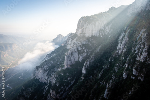 Misty Montserrat mountain covered in clouds, Catalonia, Spain.