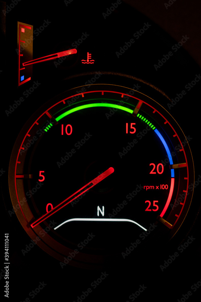 Fototapeta premium Rev counter on the dash of a truck lit up at night.