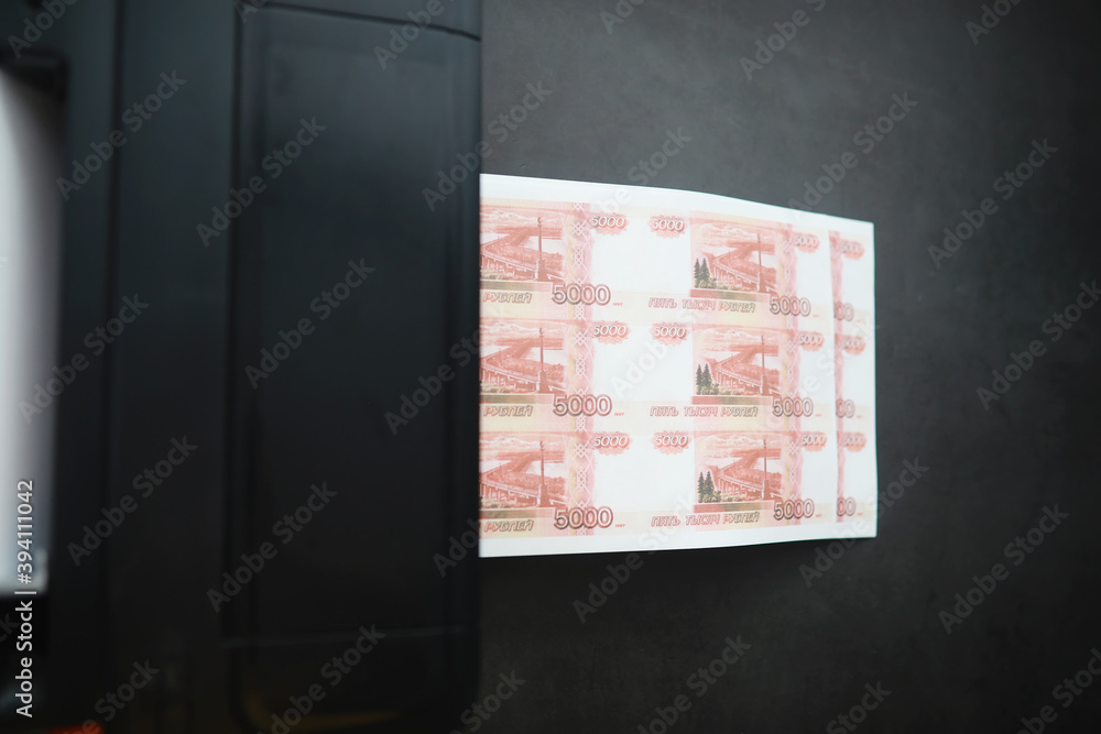 The concept of the global economic crisis. Illegal production of money, the inscription on the bill The concept of the global economic crisis. Illegal production of money, the inscription on the bill