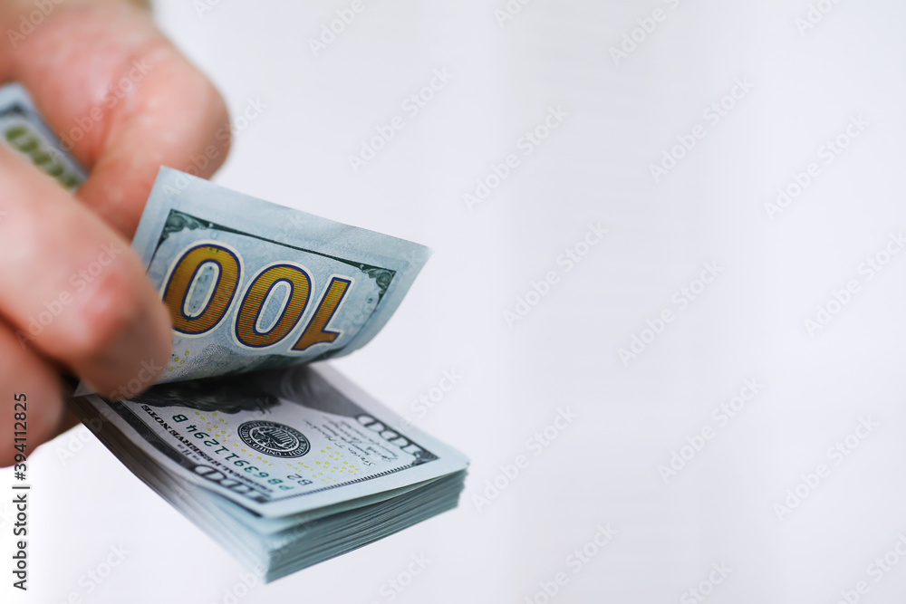 Group of money stack of 100 US dollars banknotes a lot of the background texture. Cash money in a large pile as a finance background. Group of money stack of 100 US dollars banknotes a lot of the background texture. Cash money in a large pile as a finance background.