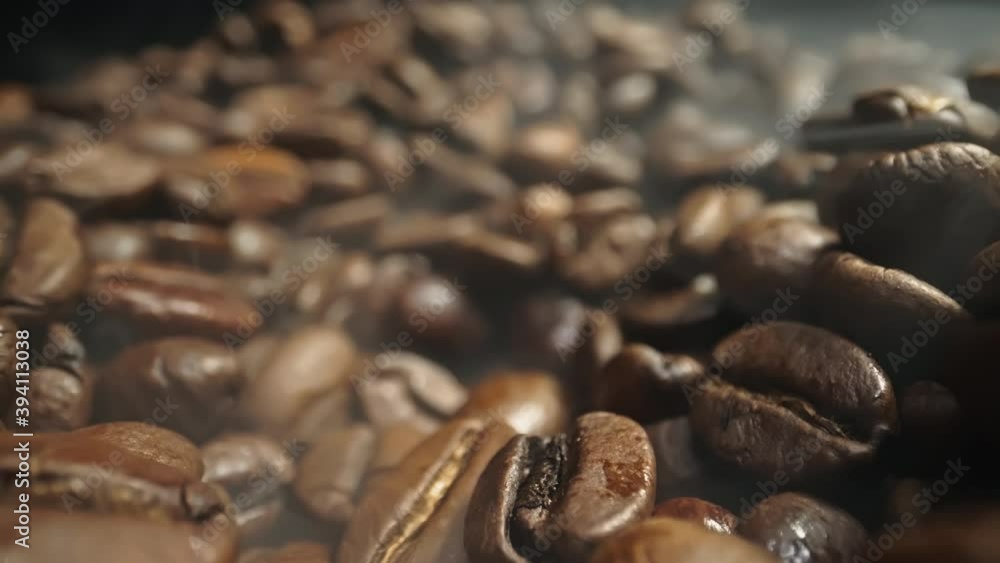 Slow moving close up through roasted coffeebeans with haze shot in 4k Slow moving close up through roasted coffeebeans with haze shot in 4k