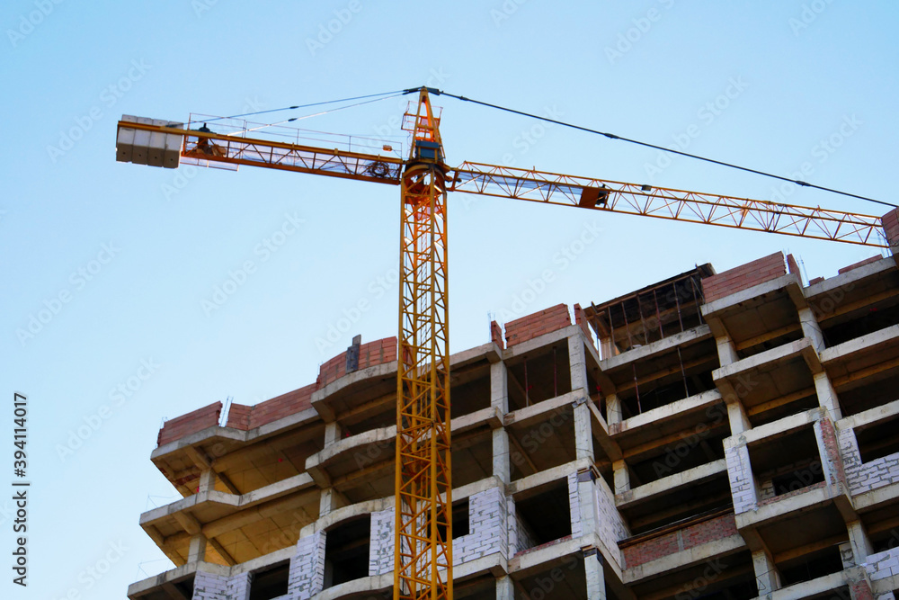 Construction site background. Crane near building. Industrial background. Construction site background. Crane near building. Industrial background.