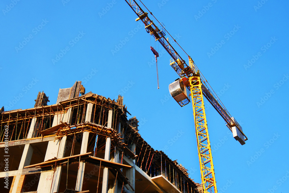 Construction site background. Crane near building. Industrial background.