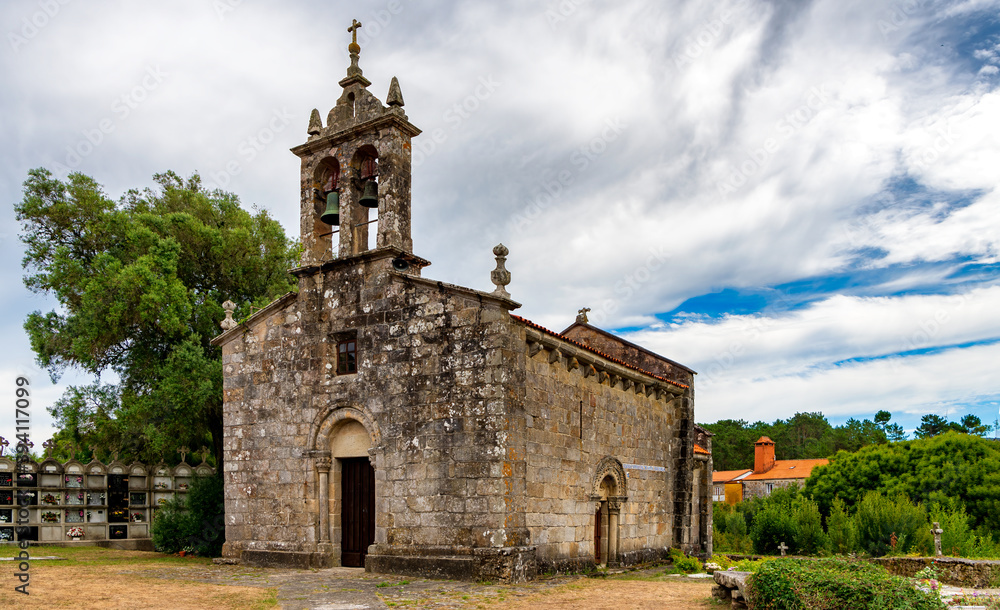 View of historic church and cemetery in Porto do Cereixo, a village in the Galicia region of Spain.