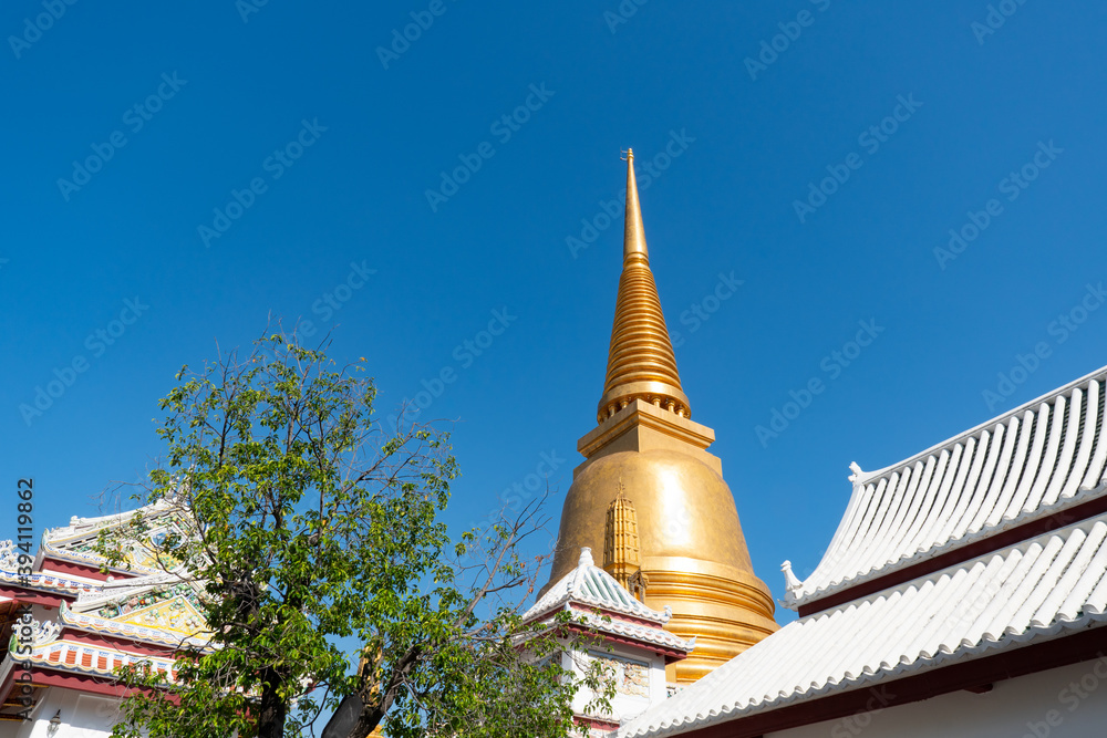 Wat Bowonniwet Vihara, Bangkok, Thailand under clear blue sky